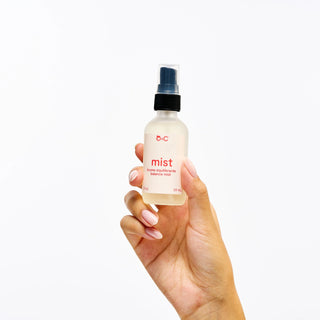 Bottle and box of Peach and Cream 'mist' skin balancing spray product on a white background