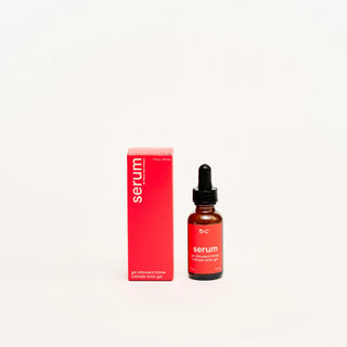 Peach and cream intimate tonic gel bottle with dropper and red box labeled 'serum' on a white background
