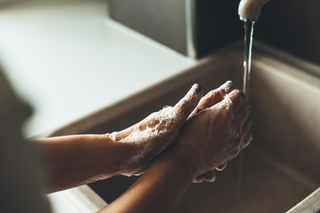 Man washing hands before washing pocket pussy