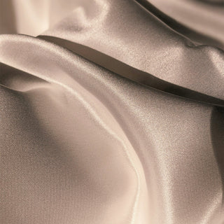 Soft champagne satin fabric in folds
