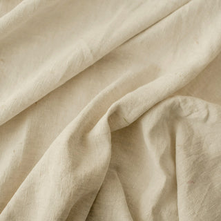 Soft folds of cream linen fabric