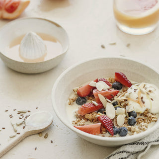 A bowl of yogurt with fresh berries and granola