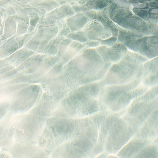 Light rippling through clear shallow water
