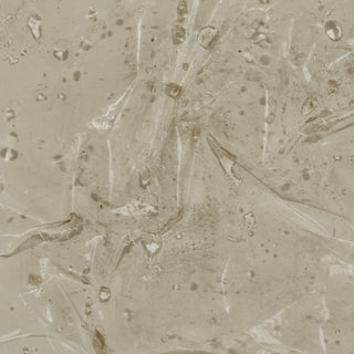 Clear gel texture spread across a beige surface