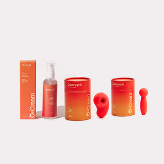 peach & cream aura air pulse vibrator, cakepop wand vibrator and honey lubricant bundle flatlay