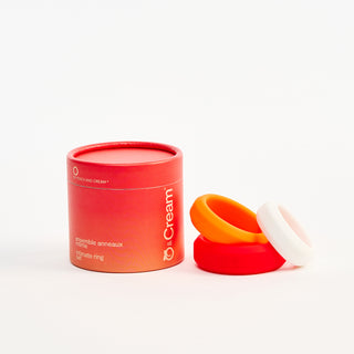 Red container with Peach and Cream 'O' intimate ring set  on a white background