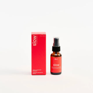 Bottle and packaging of Peach and Cream'slow' calming spray on a white background