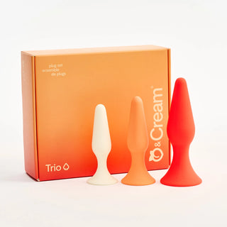 Three Peach and Cream silicone plugs in white, orange, and red with a 'Trio' box on a white background.